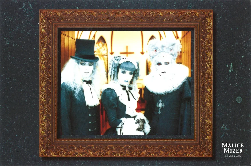 postcard of members in their Shiro look